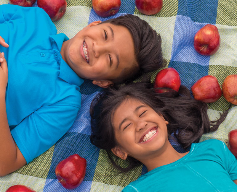 boy and girl with apples